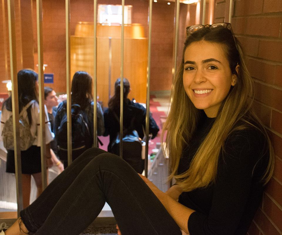 Danielle smiling with students in background