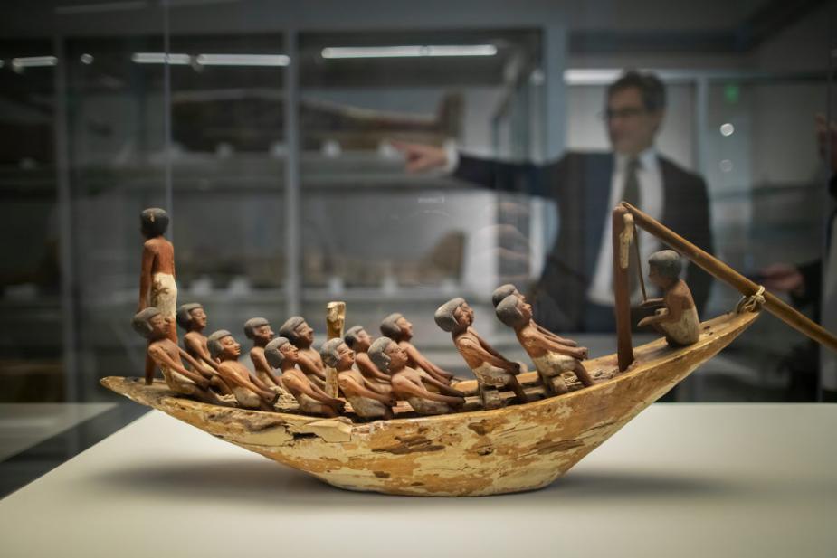 A 4,000-year-old model of a rowing boat with 16 figures, featured in a Penn Museum exhibition showcasing 200 artifacts from its vast Egyptian collection.