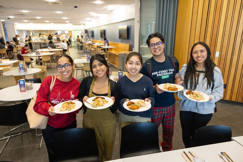 Students with plates at Hill College House's dining hall