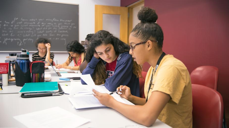 Two Penn students studying together in Winegarten.