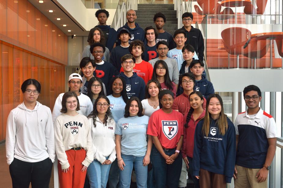 Clark Scholars posing on a staircase