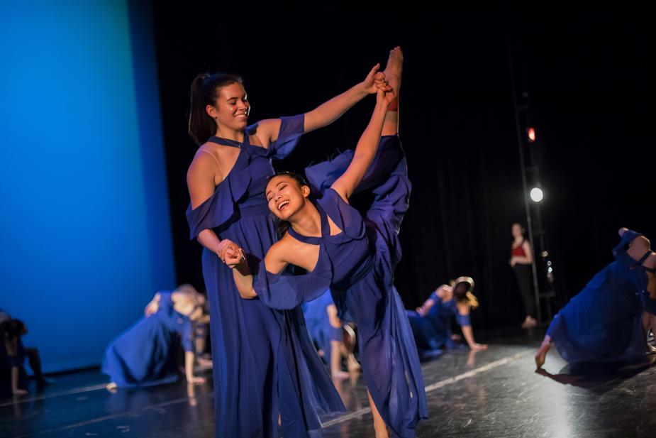 Two students performing dance piece
