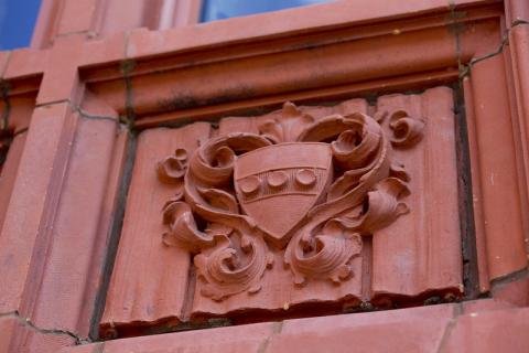 Close-up of Penn shield detail on building