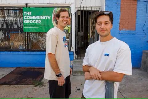 Penn alumni in front of The Community Grocer