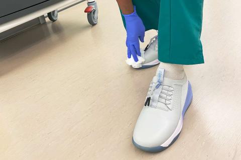 Close up photo of sneakers being worn by nurse