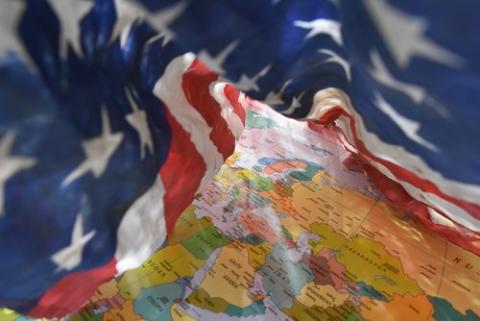 American flag over a globe