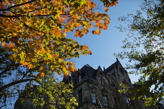 College Hall through fall leaves