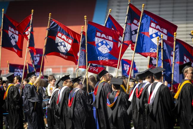 Penn Alumni class year flags at Commencement 