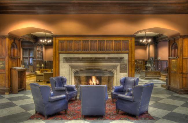 Chairs around a fireplace in Houston Hall