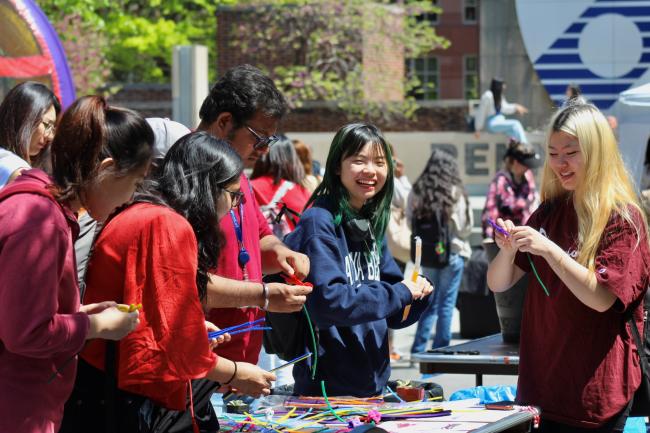 Students at a University Life fair at the Penn Commons