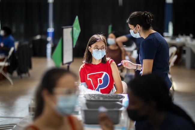 Penn student receiving vaccine.