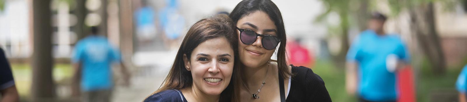 Student and parent embracing at move-in