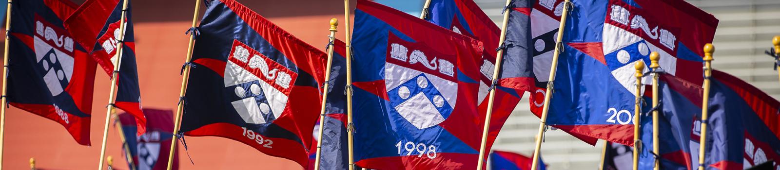 Penn Alumni class year flags at Commencement 