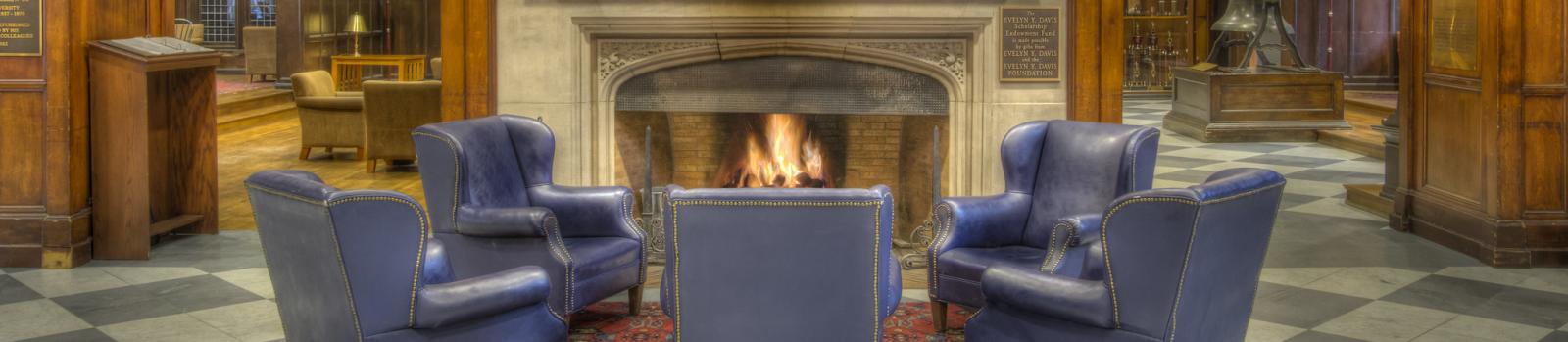 Chairs around a fireplace in Houston Hall