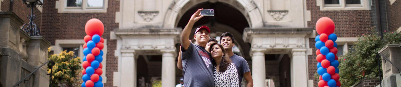 A family taking a selfie at Penn