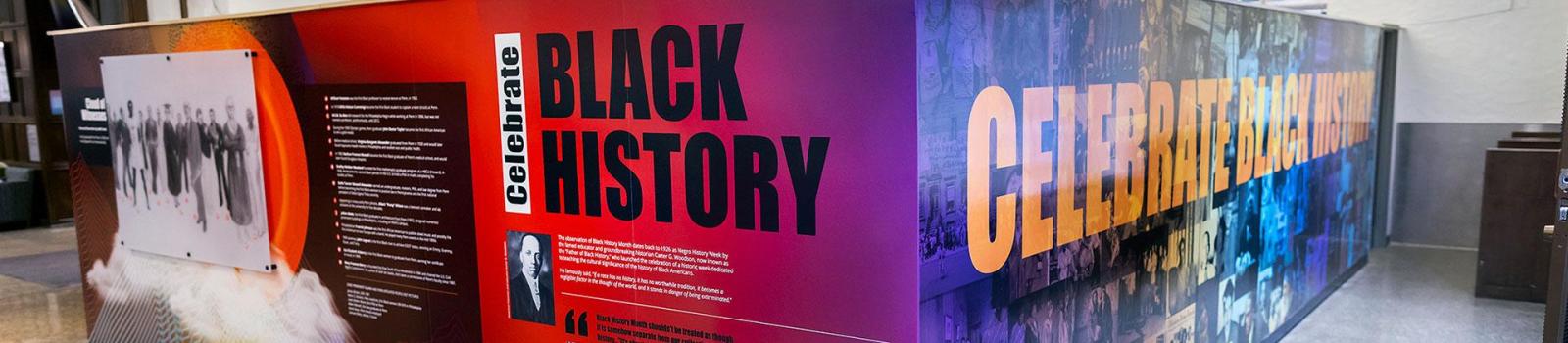 A large, colorful rectangular exhibition celebrates Black History Month at Makku.