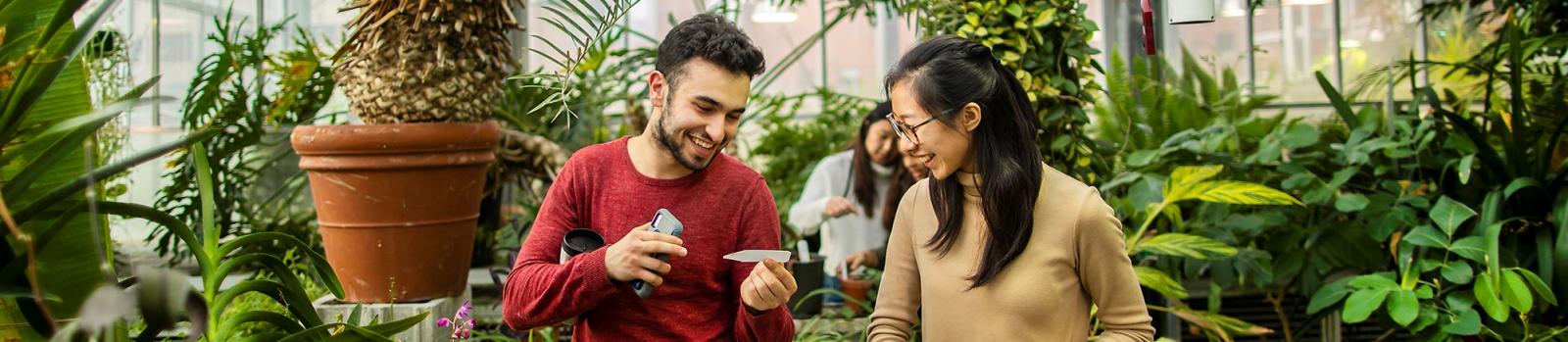 Students in Penn's greenhouse