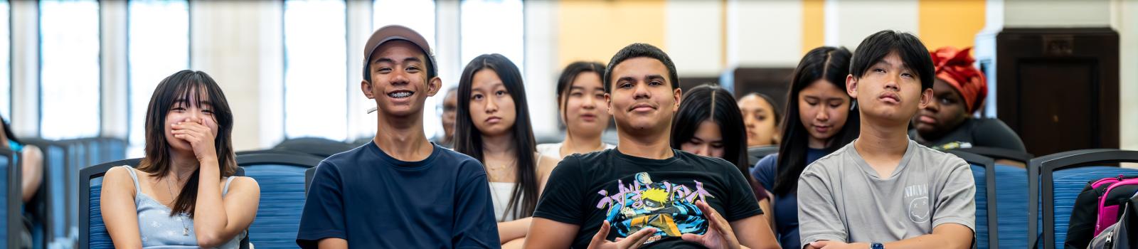 A group of students watching a presentation.